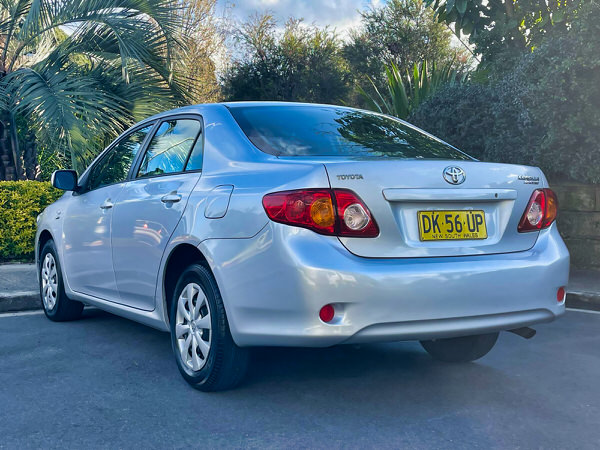 Used Toyota Corolla for sale - Model shown is a light blue 2010 Automatic Corolla in great condition with low KMS - Photo showing the rear passenger side angle view
