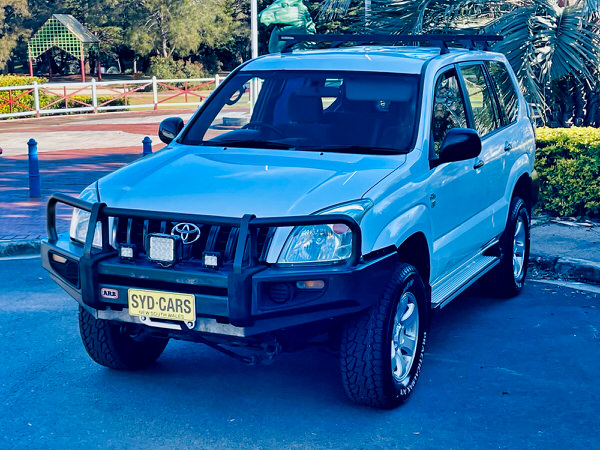 Used Toyota Prado for Sale - Manual 2008 Turbo Diesel Model with heavy duty Roo bars and roof rack - photo showing the view from the front passengers side angle with the black heavy duty roo bars included