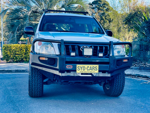 Used Toyota Prado for Sale - Manual 2008 Turbo Diesel Model with heavy duty Roo bars and roof rack - photo showing the front straight on view with the black Roo bars to protect the front of the vehicle