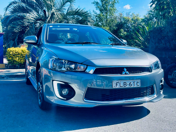 Used Mitsubishi for sale - 2017 Automatic LANCER ES SPORT 2.0L Model with low kms and service history - Photo shows the front driver side angle view showing the front body kit and matching colour coded front bumper and grille