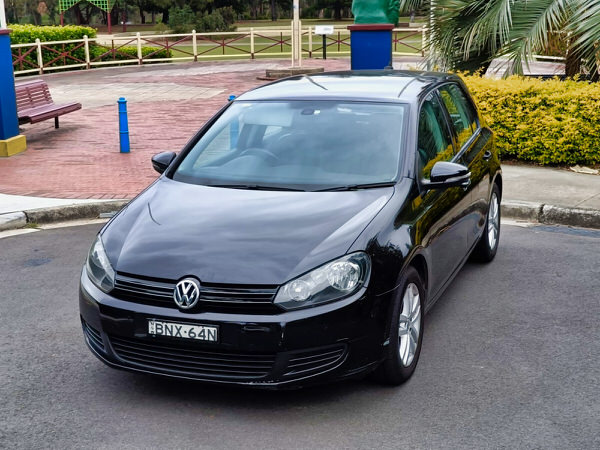 Used Golf for sale - 2010 Automatic TSI Engine model in Black - photo shows the front passenger side angle view showing the whole length of the car